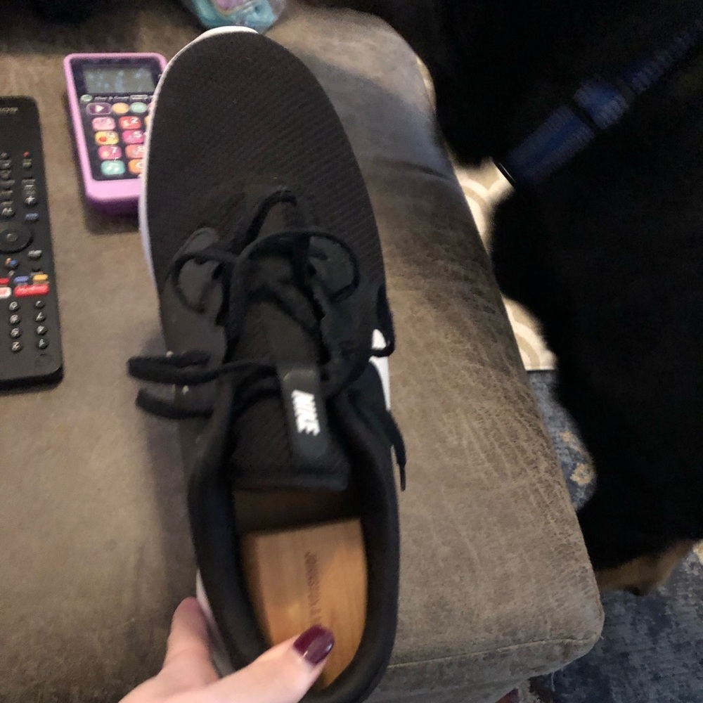 Men’s Nike size 12 golf shoes.